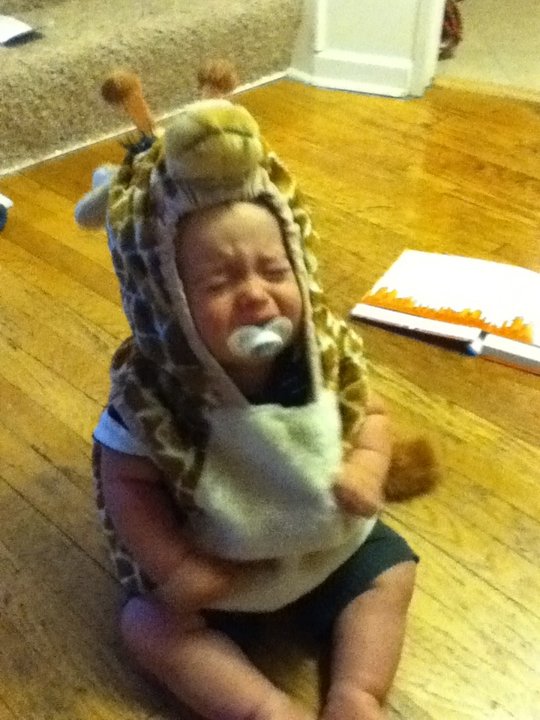 He is in a giraffe costume.